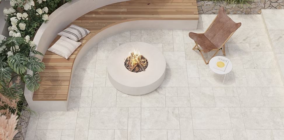 Light Travertino Bianco French pattern tiles in an outdoor entertaining area
